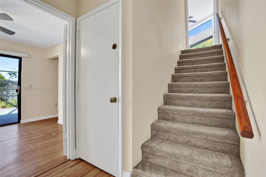 Garage access between the upstairs bedroom and a downstairs bedroom.
