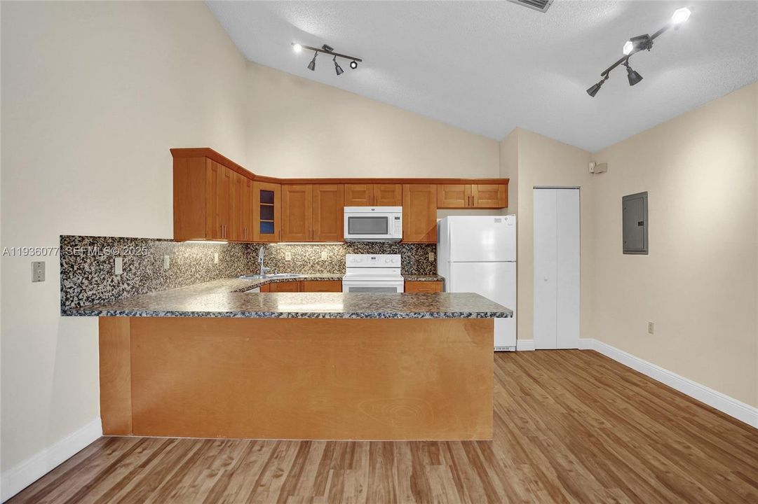 Accented by vaulted ceilings and pantry storage &2025 electrical panel!