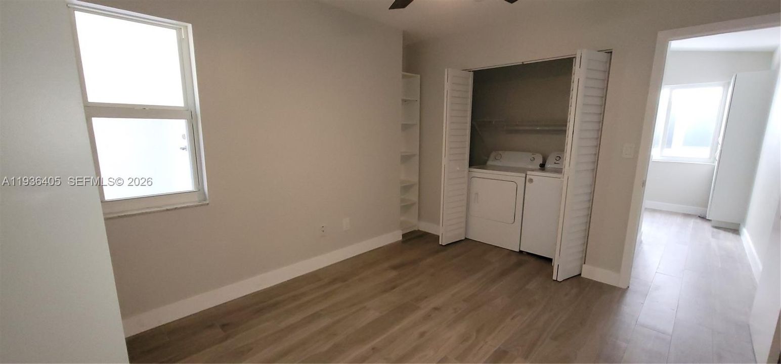 Garage was converted into a Den with a window, a small closet and is where the Washer, Dryer and Water Heater  are located. Den has connects to a small storage with a door and has access to the street through the garage main door.