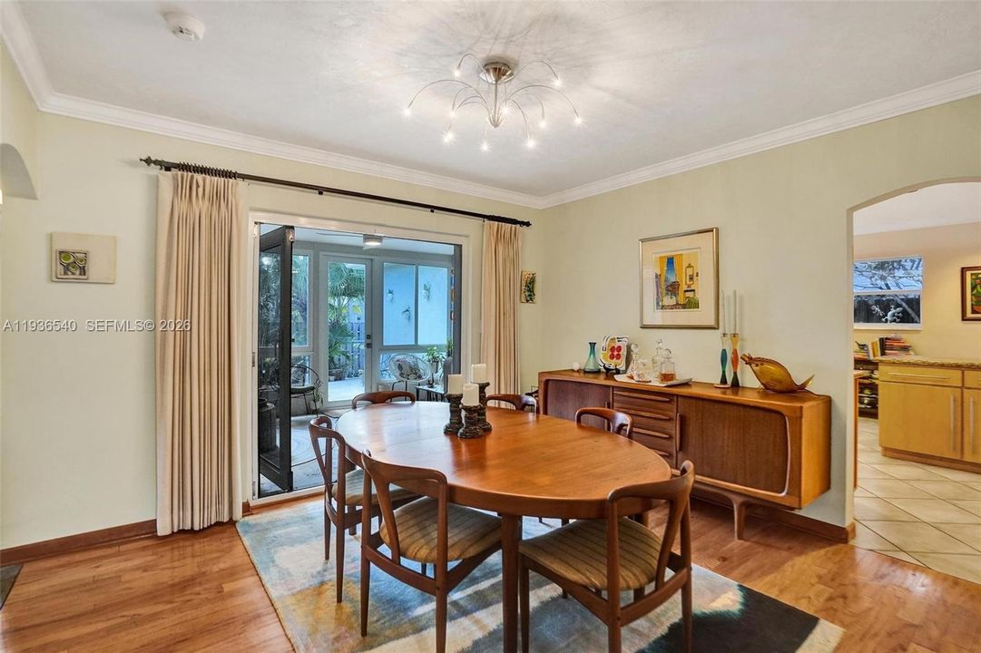 Dining room opening to the sunroom.