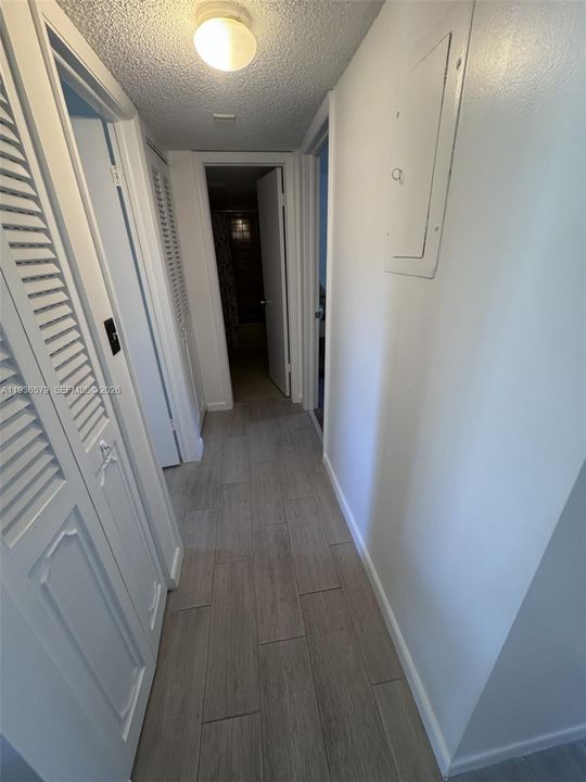 Hallway to guest bath and bedrooms