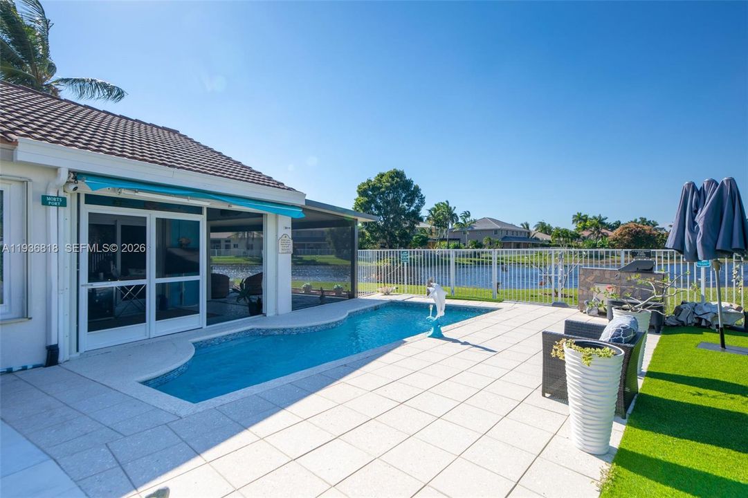 Relax by the pool and enjoy the peaceful open view of the lake