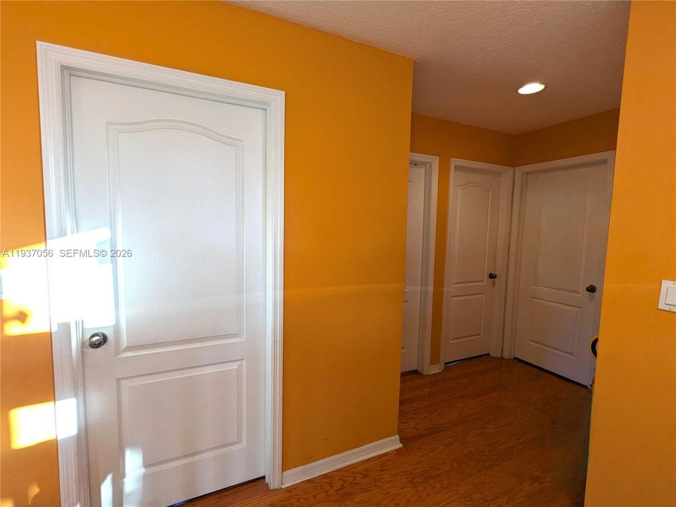 Central hallway providing access to three bedrooms and 2nd bathroom