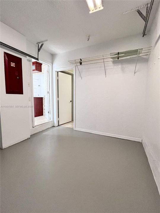 8 x 9 - half of it is storage, not large enough for a car