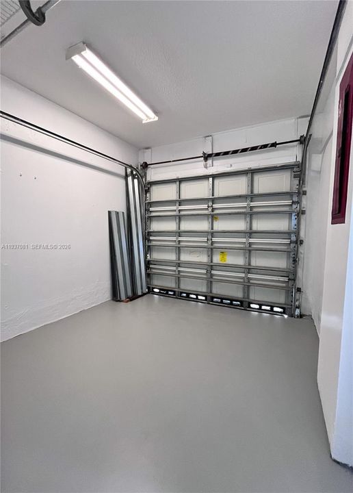 8 x 9 - half of it is storage, not large enough for a car