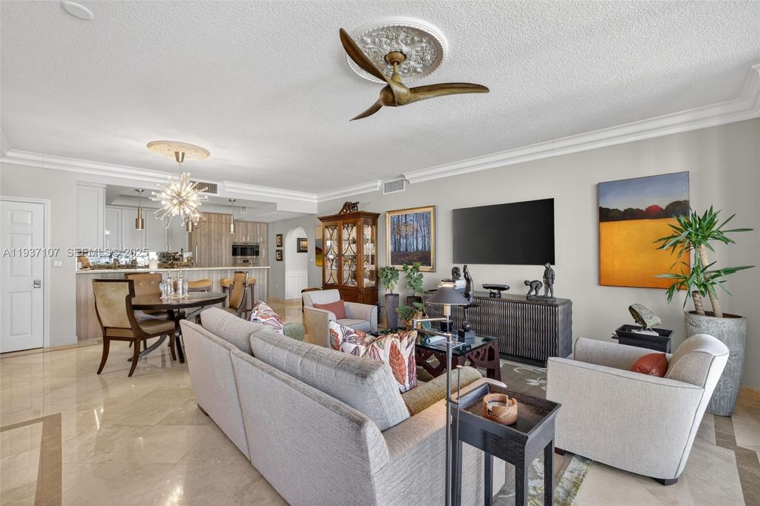 Marble flooring, water views, floor to ceiling glass, crown molding. Bright open and airy.