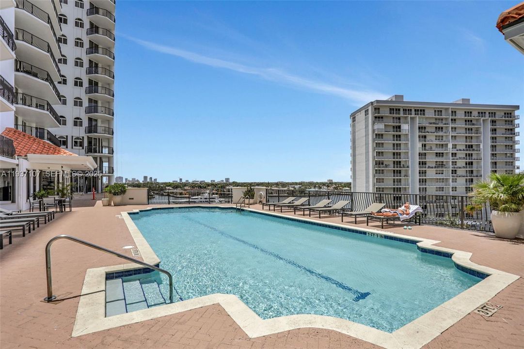 Pool deck w/ views to the intracoastal. Gas Grill on deck.