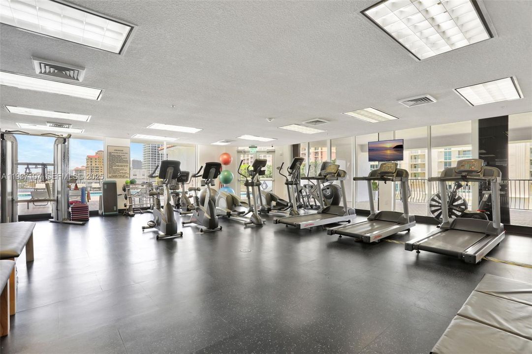 Fitness center w/ views to the pool deck