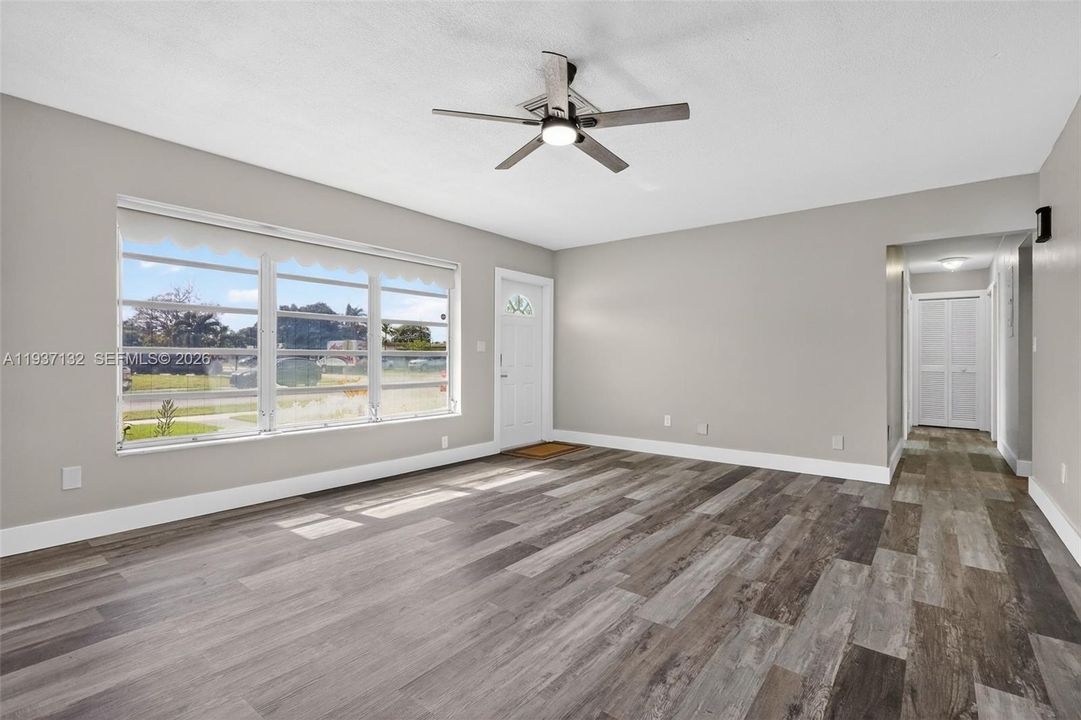VIEW OF DINING ROOM KITHCEN AND ONE OF TWO LIVING ROOMS