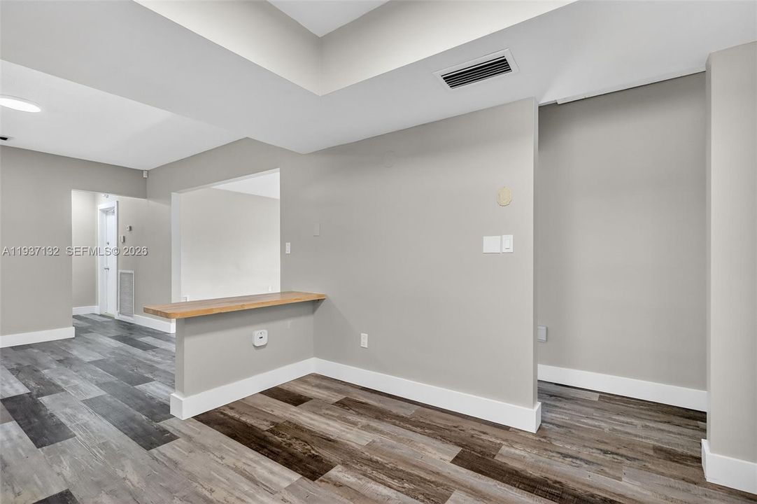 VIEW OF DINING AND 1ST LIVING ROOM