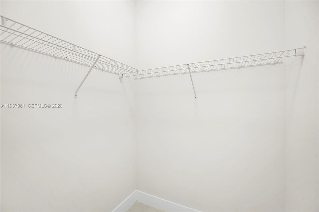 Walk-in closet serving the first-floor en-suite bedroom