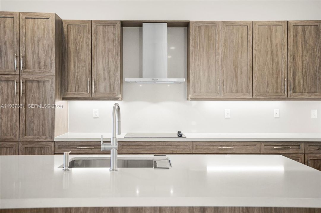 Expanded kitchen cabinetry with premium finishes