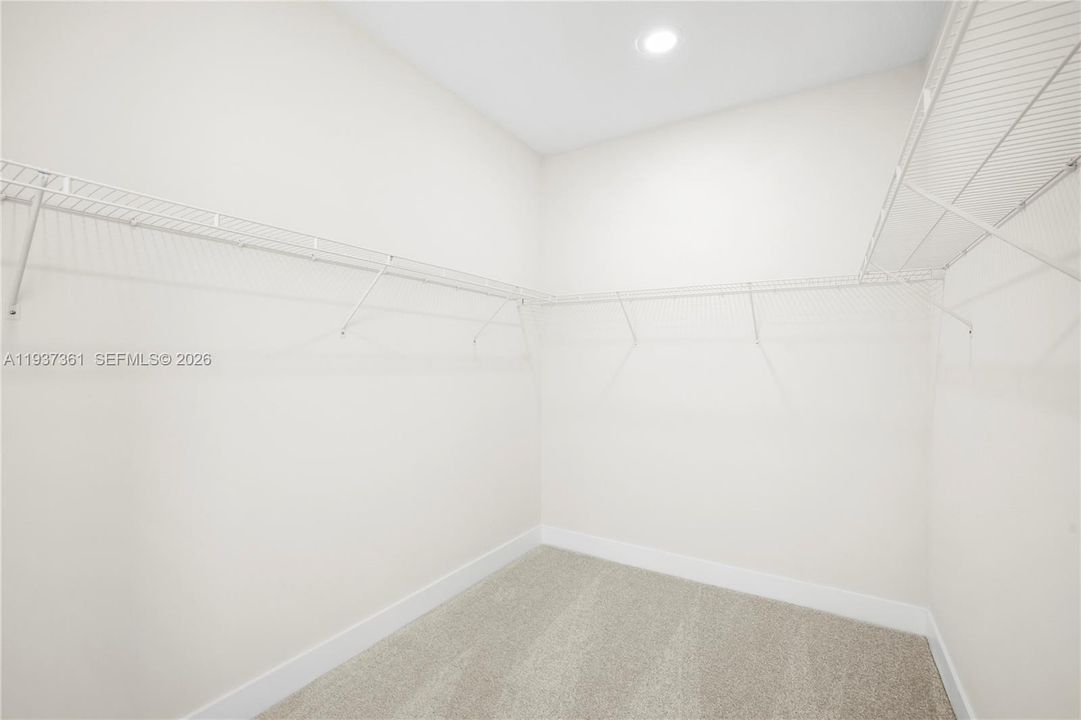 Alternate view of oversized primary walk-in closet