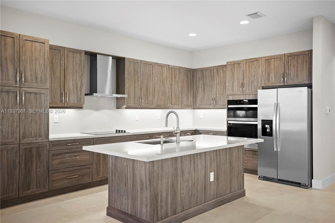 Kitchen island with quartz countertops and seating