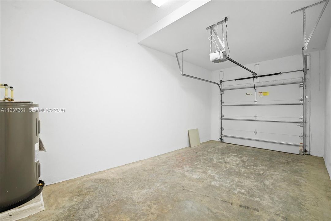 Single-car garage bay completing the three-car garage configuration