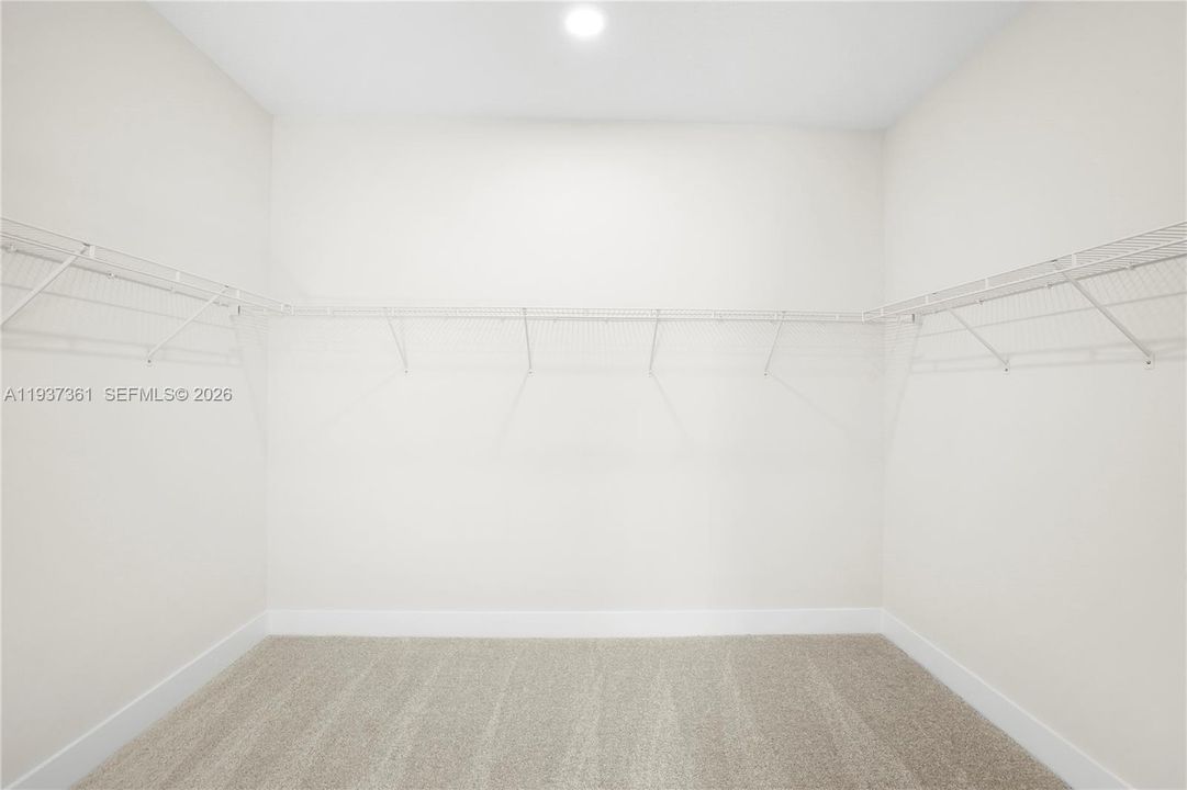 Oversized walk-in closet in the primary suite