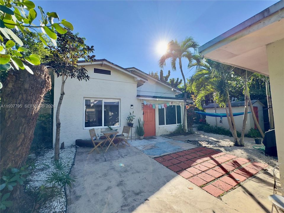 cottage-style unit in the rear of the property - separate structure with separate meters