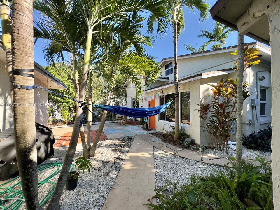 cottage-style unit in the rear of the property - separate structure with separate meters
