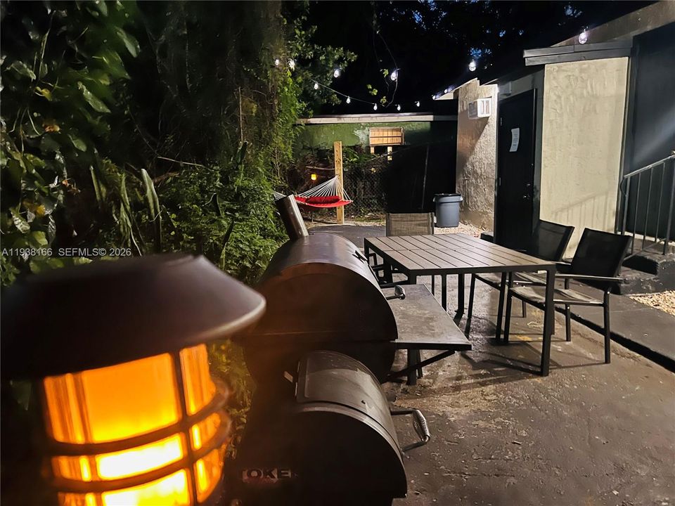 Night time view of entertainment area around back.