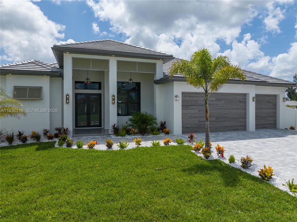 A SPLIT FLOOR PLAN ensures privacy, with a second master suite, guest bedroom, hall bath, and ample storage including a linen closet.