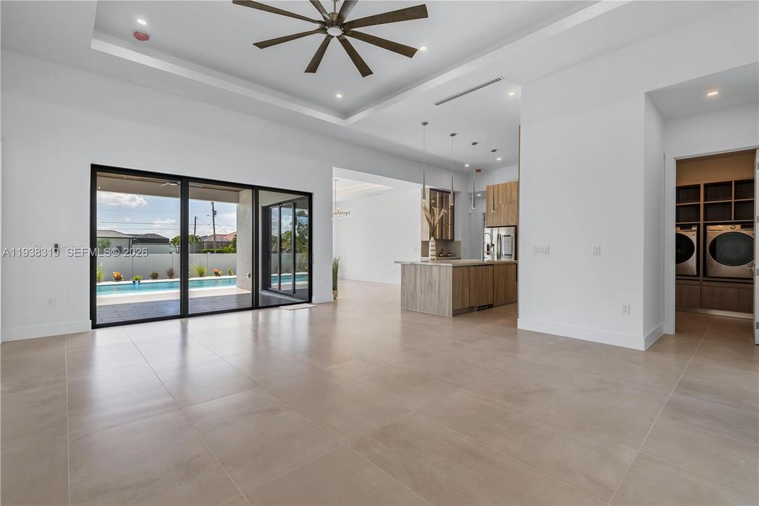 The contemporary living room features clean lines, modern finishes, and an open layout designed for comfort and everyday living.