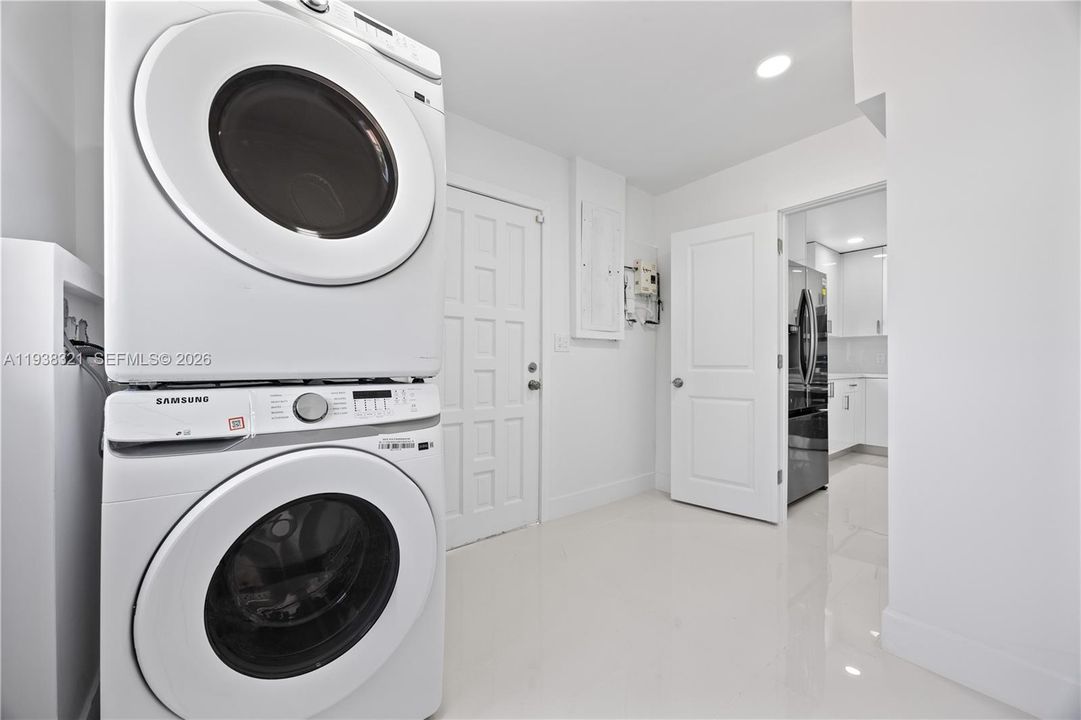 Tankless water heater is in the spacious laundry room.