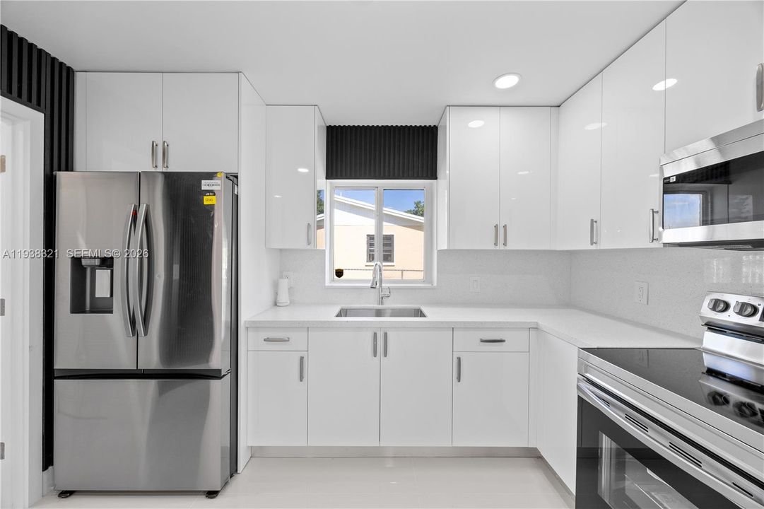 Gorgeous kitchen with custom made cabinets.