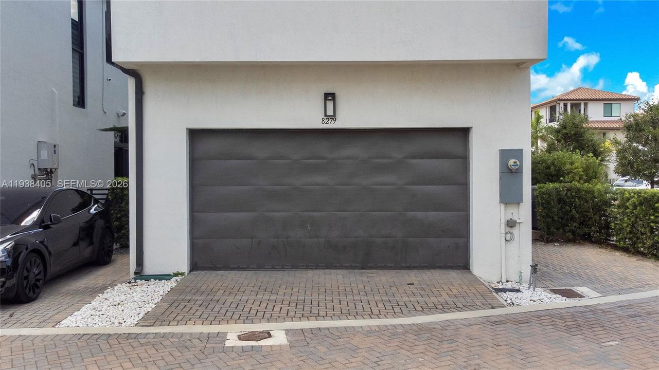 2 car garage plus 2 additional exterior private parking spots (right side and behind garage).