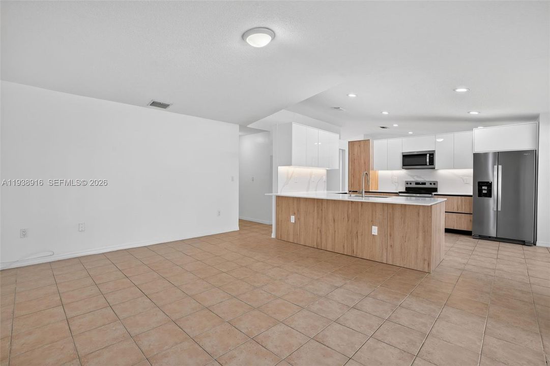 KITCHEN AND FAMILY ROOM OTHER ANGLE