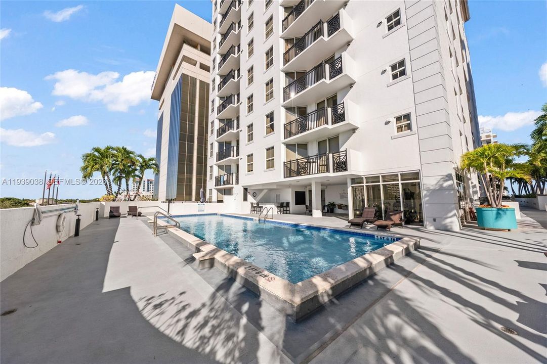 Gym, sitting area, bar, pool and jogging path can be seen