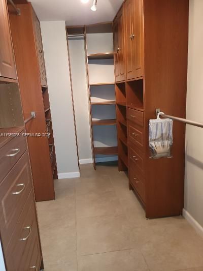 Master Bedroom Walkin Closet with built-in shelving