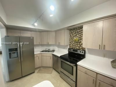 Kitchen with new tray ceiling and lighting