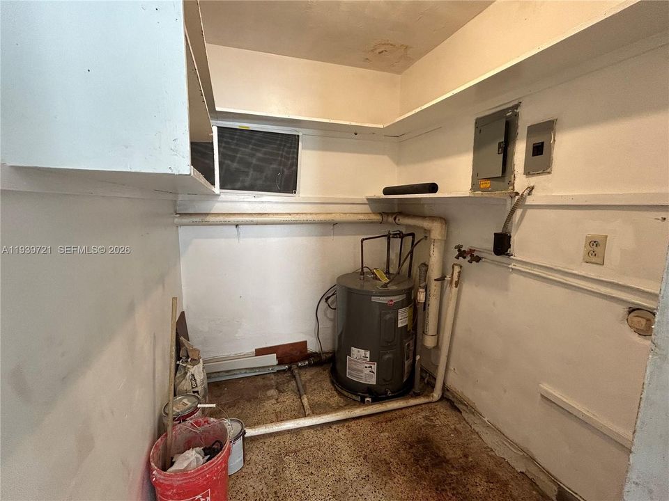 Utility room with laundry hook-up.