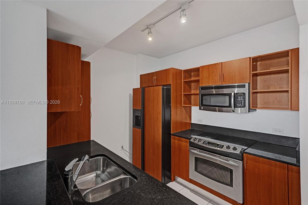 SPECIAL PRICE!!! Buy a 2-BEDROOM Deal – Priced Like a 1-Bedroom at 2775 NE 187TH ST #202 — PRICE, LOCATION! Walking distance to Publix, parks, shops, and synagogues — everything you need just steps away! Step into this beautifully updated apartment offering: spacious bedrooms, each with walk-in closets,A modern kitchen with granite countertops and stainless steel appliances, Laminate flooring throughout, In-unit washer and dryer.Enjoy resort-style amenities, including:4 infinity pools with cabanas,State-of-