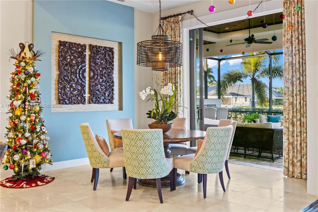 Light-filled dining room featuring premium finishes and seamless access to the outdoor living space.