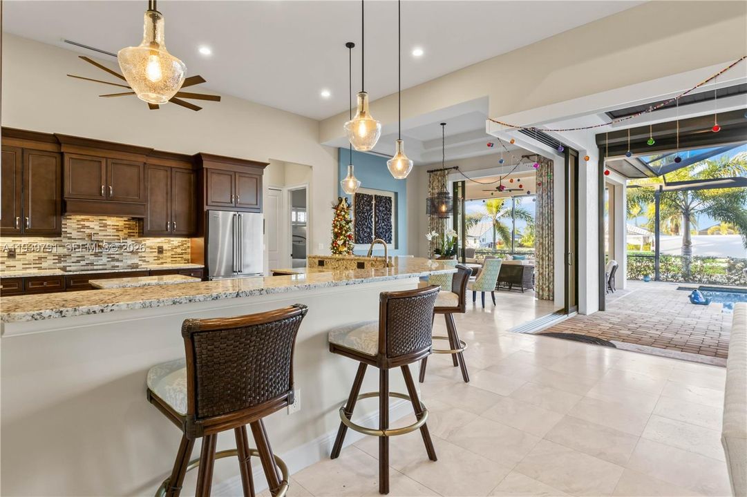 Open kitchen with natural light, high-end finishes, and easy flow into dining and living areas, perfect for entertaining.