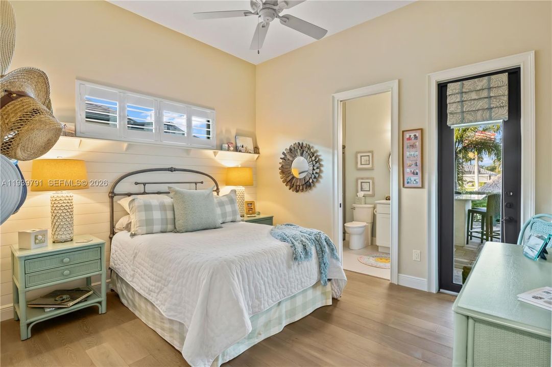 Bright, inviting guest room with its own bathroom and access to outdoor pool.