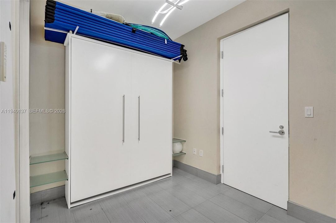 Maids room which includes Murphy bed, Full bathroom, A wall of closets and service maintenance entrance