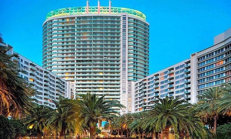 Palm tree courtyard and 3 towers on 16 acres