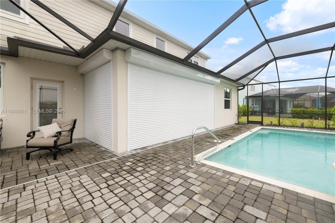 electrical lanai shutter for additional protection. Home has impact windows & front door