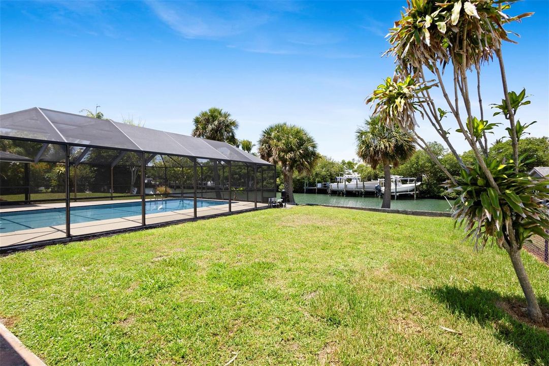 Large private backyard overlooking canal