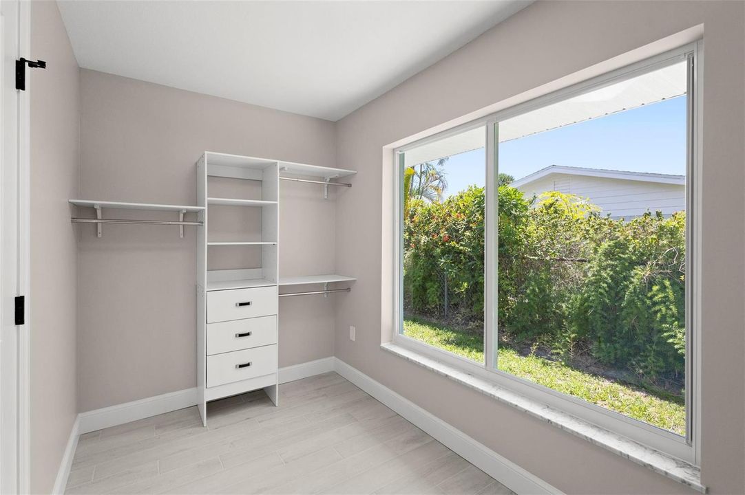 Primary closet with built-in shelving