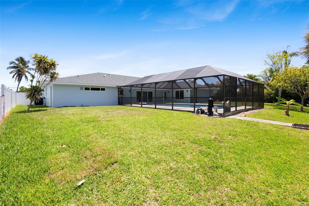 Large private backyard overlooking canal