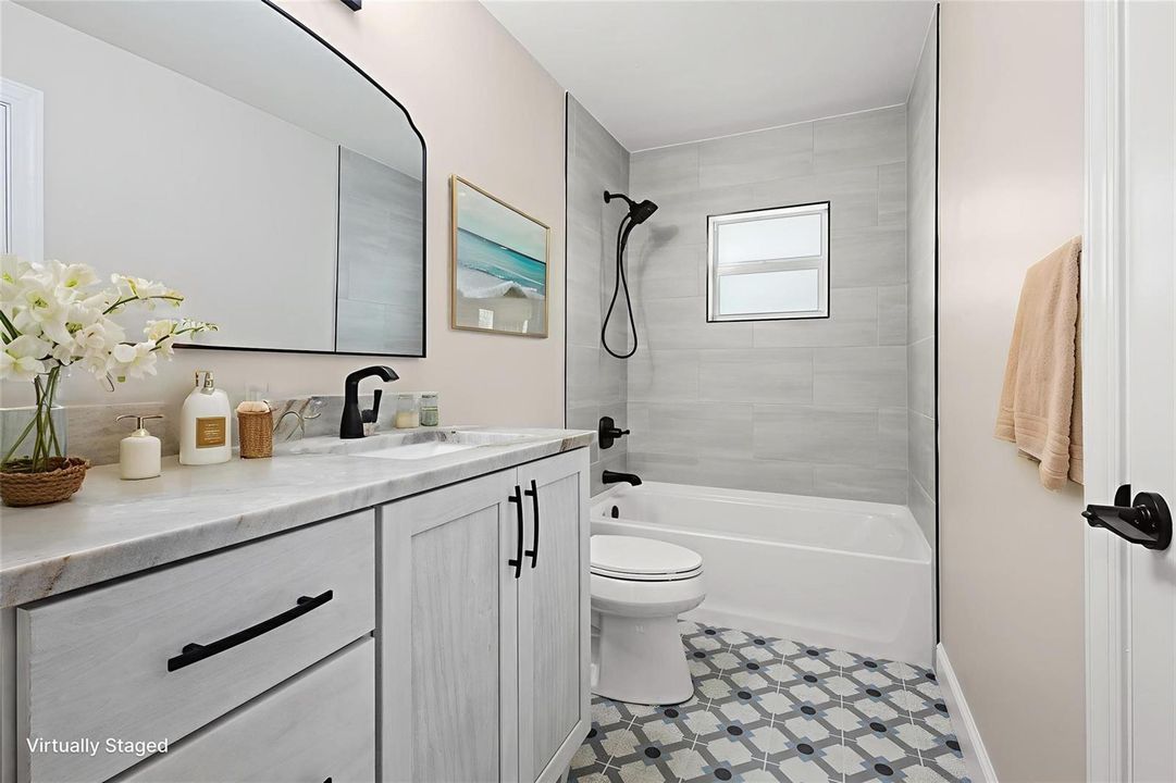 Full bath with designer tile flooring