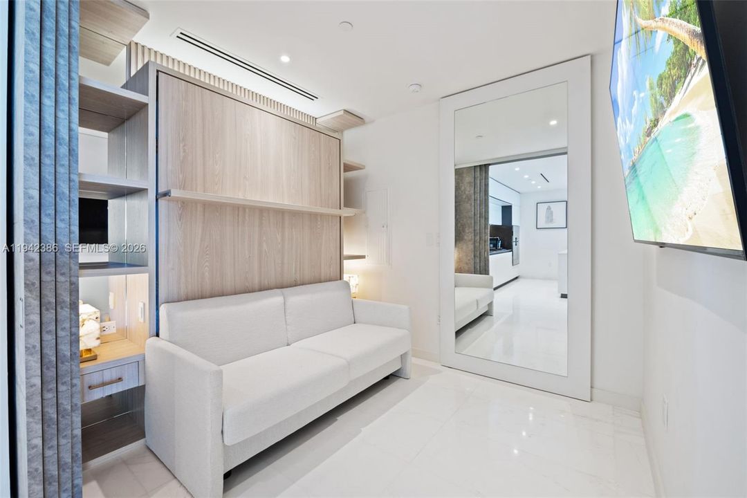 Den with closet slider closed; roller door added for a sleeker look.