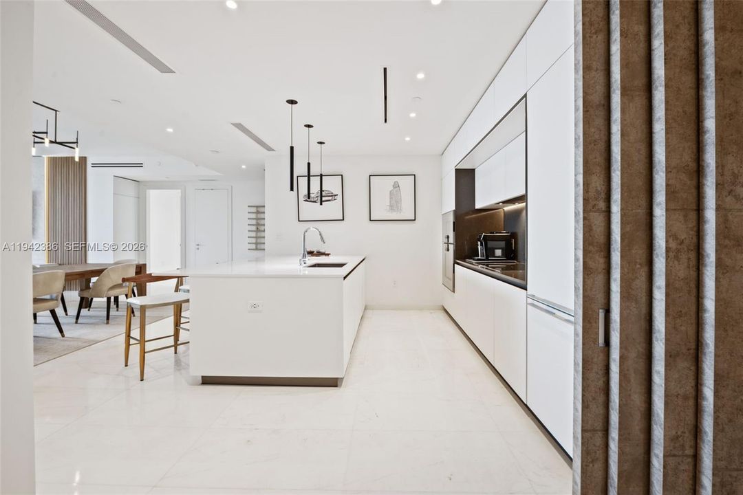 Den looking into kitchen.