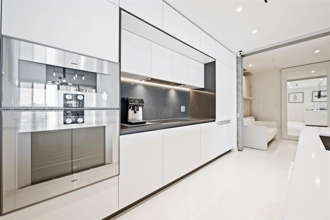 Added additional Bulthaup cabinetry and lowered the hood to create more storage.