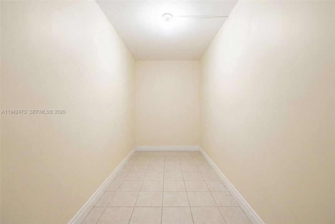 Huge walk in closet can be divided between two bedrooms or converted into small office