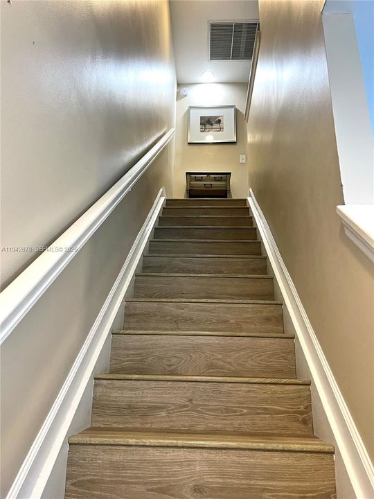 High-end, waterproof wood flooring throughout
