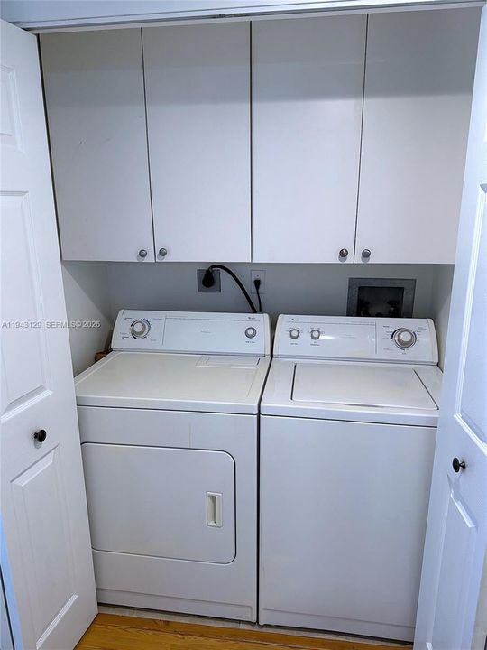Full size washer and dryer with cabinets